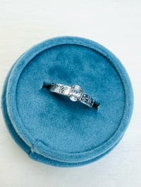 Image 1 of white sapphire ring with paisley band