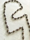 peacock pearl rosary style necklace with peridot, pearl, and iolite
