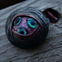 Image 5 of Custom Swappable Phone Grip for smartphones, three iris, reflective pupils, glow in the dark