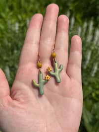 Image 1 of saguaros