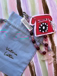 Image 2 of glass bead phone charms with trinkets 