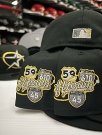 Image 2 of New Era 59Fifty Black White Gold Oval Star Slab City
