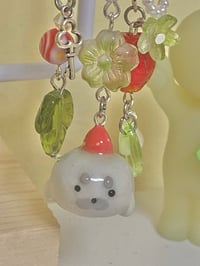 Image 2 of strawberry seal clay keychain