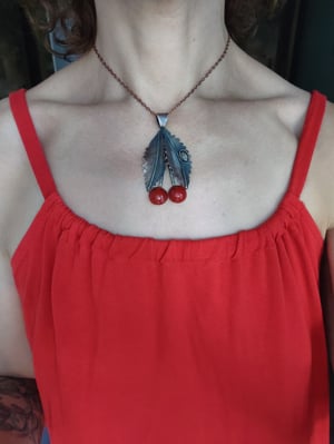 Cherry pendant with ladybug 