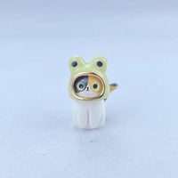 Image 1 of calico cat with frog hat ceramic figurine