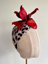 Image 1 of Leopard fabric covered headpiece w large red flower