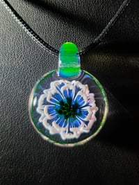 Image 1 of Uv reactive flower pendant. 
