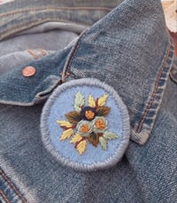 Image 1 of Hand embroidered florals on felt pin badge - Blue
