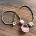 Image of Hawaiian sunrise or moonrise shell necklace with golden pukas and a locking seaglass clasp