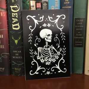 Remission Skeleton And Filigree Print On Board