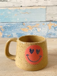 Image 1 of Stumpy smiley cup.