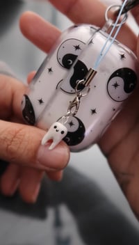 Image 1 of micro tooth charm