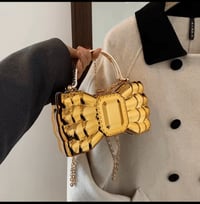 Gold bow purse 