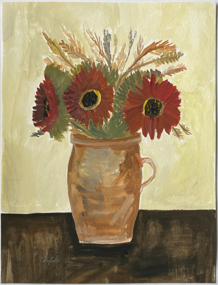 Image of Deep red sunflowers in a ceramic jar