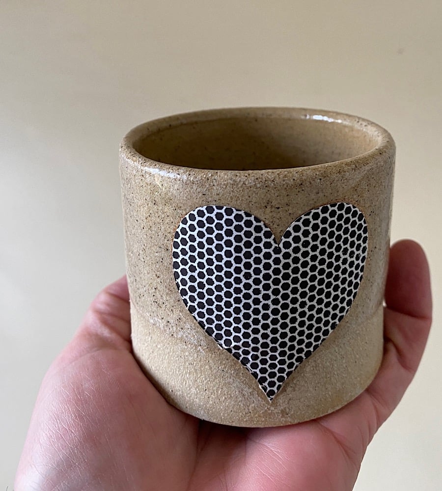 Speckled partial glazed match pot.