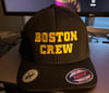 Black Flexfit hat with yellow “Boston Crew" Logo