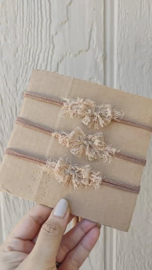 Image of Latte lace bows