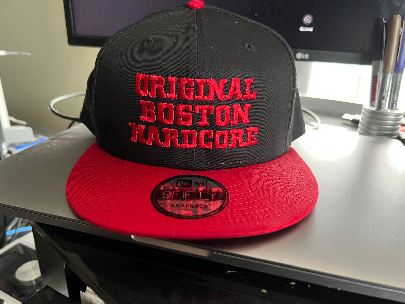 Black and red store flat bill hat