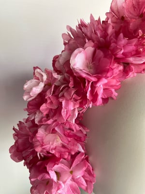 Image of Rose pink flower headpiece. 