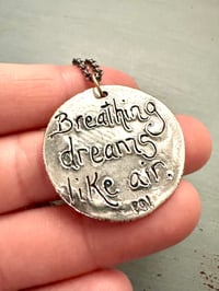 Image 7 of blue sapphire pendant with Fitzgerald quote