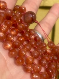 Image 2 of Sunstone Mala with Fire Quartz Guru Bead, Oligoclaise Sunstone 108 Bead Hand Knotted Gemstone Mala