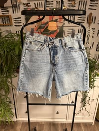 Image 1 of Fashion Nova side button shorts 