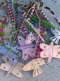 Image 1 of glass bead keyrings with butterfly or mushroom trinket  