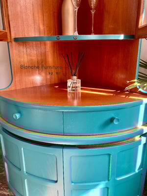 Image of Nathan Corner Drinks Cabinet unit with light in vibrant teal