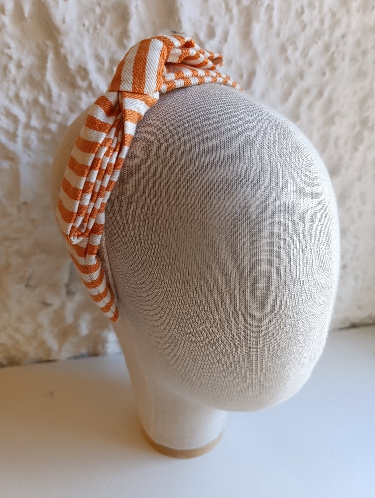 Image of Cerchietto a fiocco righe bianco/arancione