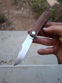Image 1 of Clip point slippie. Natural  micarta. 
