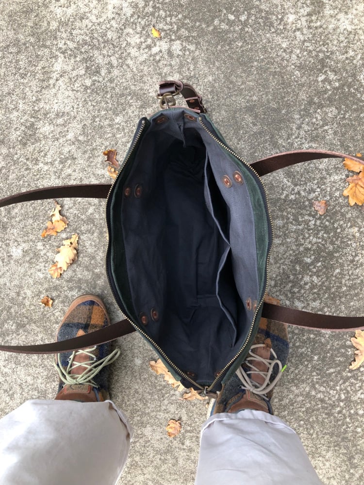 Image of  Waxed canvas carryall with handwoven exterior pocket in forest green