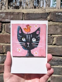 Image 1 of Black cat, daisies and mini chick