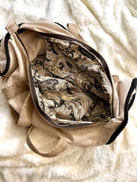 Image 4 of Tan + Black Duffle Bag
