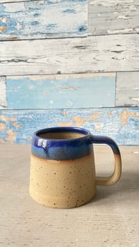 Image 4 of Blue rimmed mug.