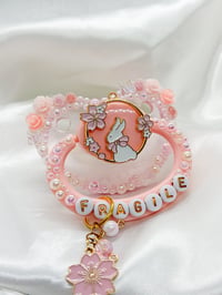 Image 1 of Fragile bun