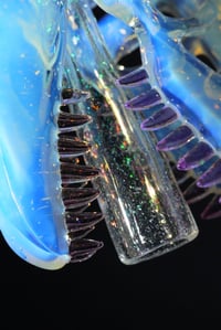 Image 5 of Glopal (uv reactive) T-Rex skull pendant with dichro tip and crushed opal teeth. 