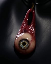 Image 1 of Optic Nerve-glow in the dark eye pendant with “eye shine” pupil