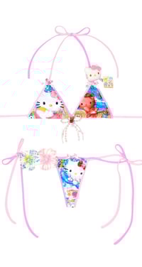 Image 2 of tanned hellokitty in the beach ball game