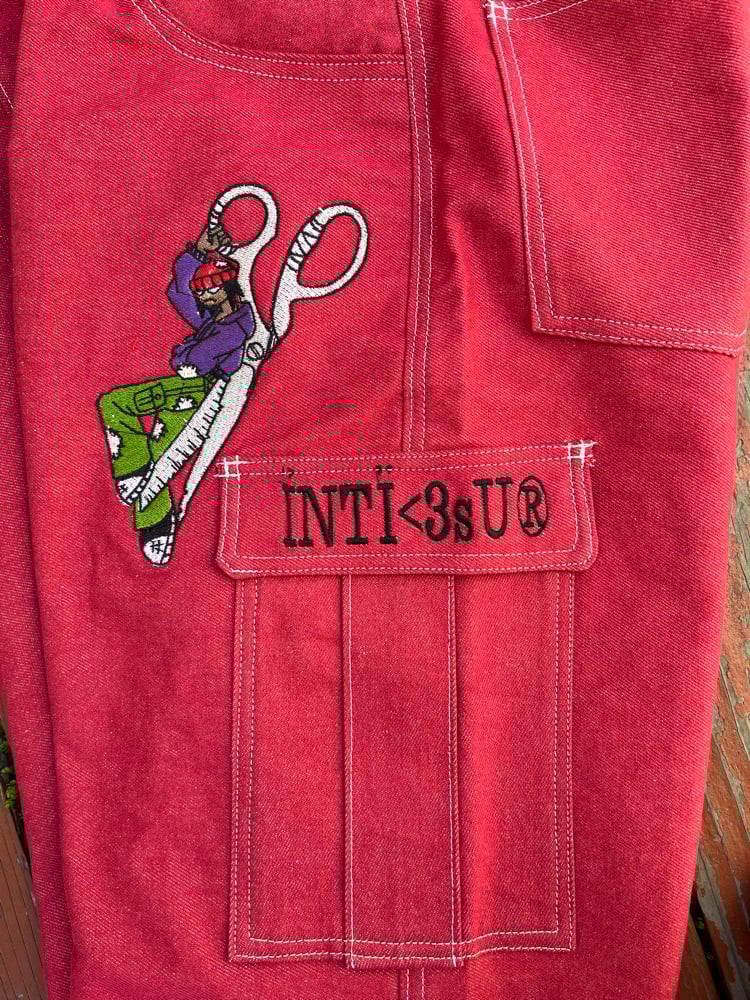 Image of red denim embroidered jeans