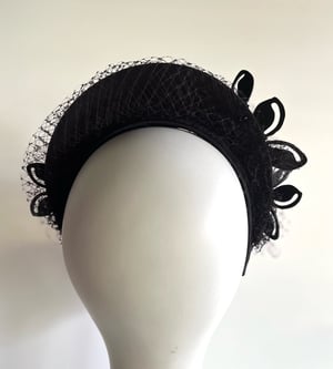 Image of Black felt halo w acrylic flowers.