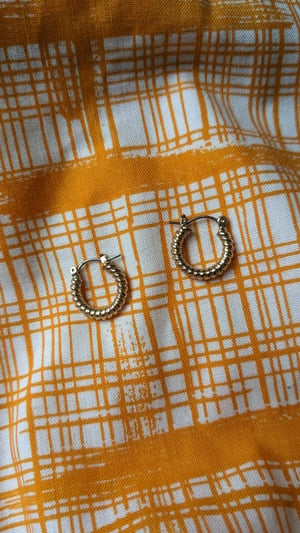 Image of Vintage gold toned small twist hoop earrings