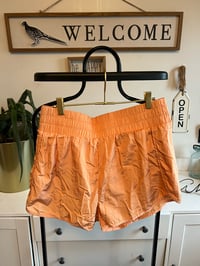 Image 1 of Orange running shorts 