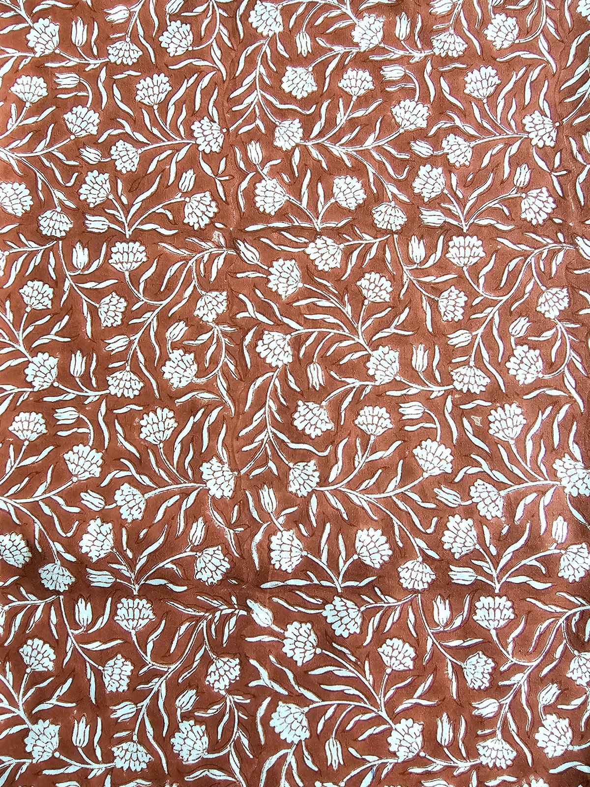 Image of Namaste fabric petits œillet fond brique 