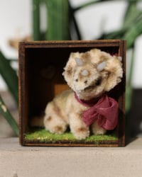Image 1 of Pipe cleaner triceratops with wooden modular display