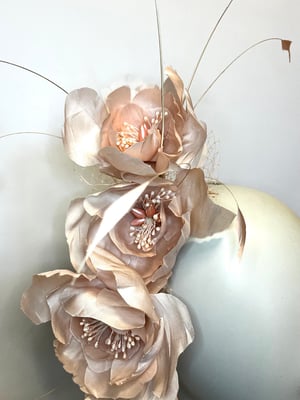 Image of Pale pink silk flower headpiece.