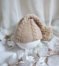 Image 1 of Newborn knitted sleep hat for photoshoot | warm beige | with pompom