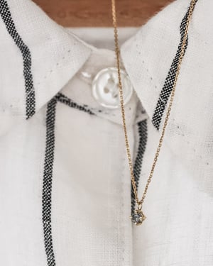 Image of 18ct yellow gold, pale grey salt and pepper diamond necklace