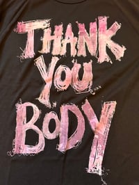 Image 1 of Black 70s style t shirt with light pink text (size14/tightmedium)