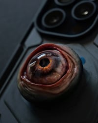 Image 7 of Custom Swappable Phone Grip for smartphones, reflective pupil, green glow in the dark