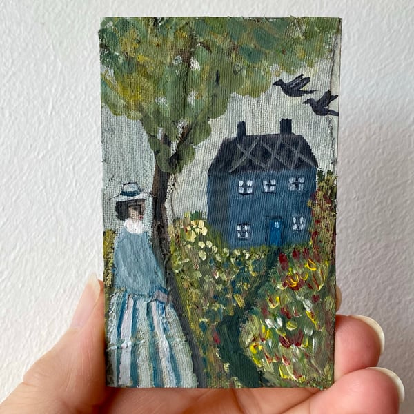 Image of old blue cottage in summer